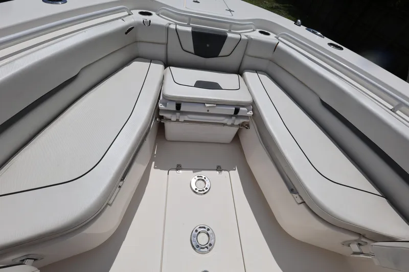 Slide: The Image of 2017 Wellcraft Scarab 302 Fisherman boat interior with cushioned seating and storage compartments. - 19