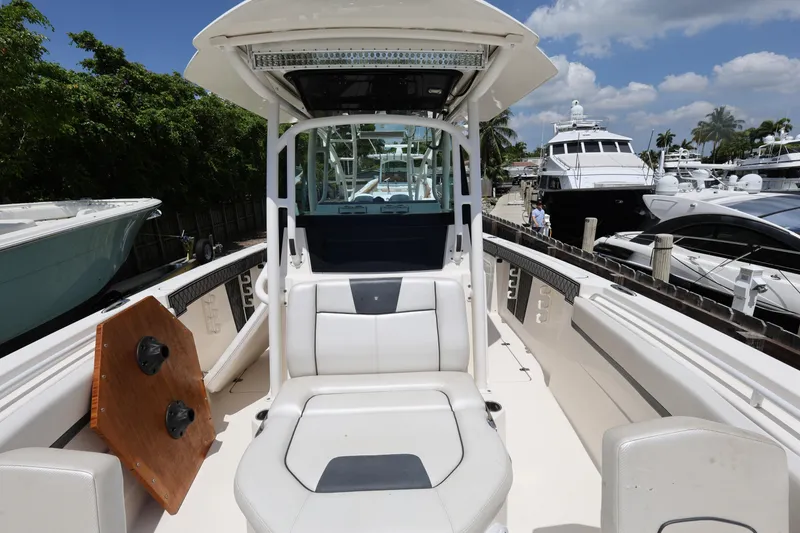 Slide: The Image of 2017 Wellcraft Scarab 302 Fisherman boat docked, featuring sleek seating and modern design. - 22