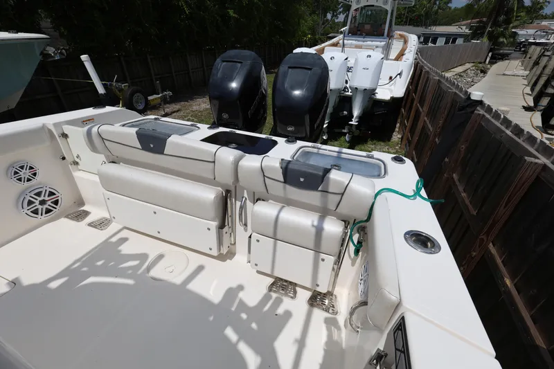 Slide: The Image of 2017 Wellcraft Scarab 302 Fisherman boat interior with seating and dual outboard motors. - 26