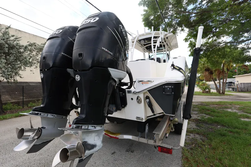 Slide: The Image of 2017 Wellcraft Scarab 302 Fisherman boat with dual outboard engines on a trailer. - 5