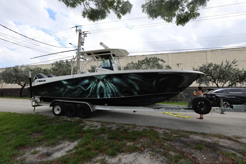 Slide: The Image of 2017 Wellcraft Scarab 302 Fisherman boat on trailer, parked on roadside. - 7