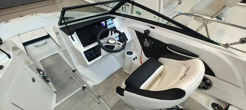 Slide: The Image of 2023 Sea Ray SPX 190 boat interior with modern helm and comfortable seating. - 10