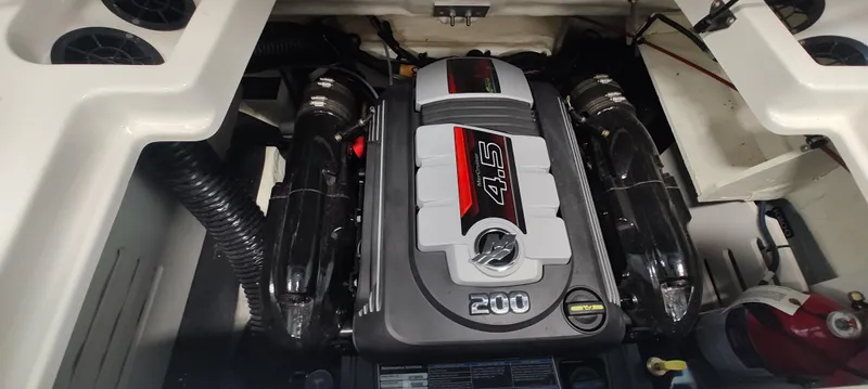 Slide: The Image of Engine compartment of a 2023 Sea Ray SPX 190 boat, featuring a 4.5L 200 HP engine. - 14