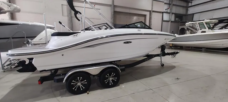 Slide: The Image of 2023 Sea Ray SPX 190 boat on trailer in indoor storage facility. - 4