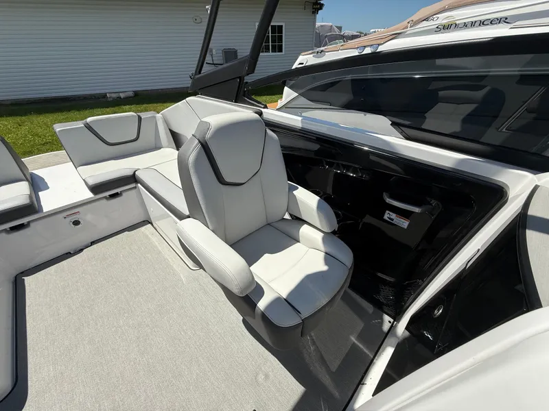 Slide: The Image of 2022 Yamaha Boats AR250 interior with white seating and modern design. - 12