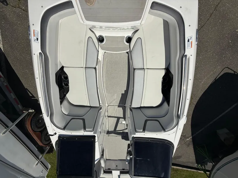 Slide: The Image of 2022 Yamaha Boats AR250 interior, featuring spacious seating and modern design. - 14