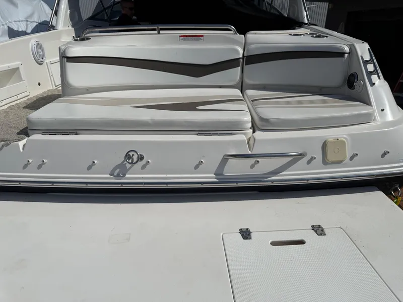Slide: The Image of 2007 Rinker 282 Captiva Bowrider boat with white seating and swim platform. - 2