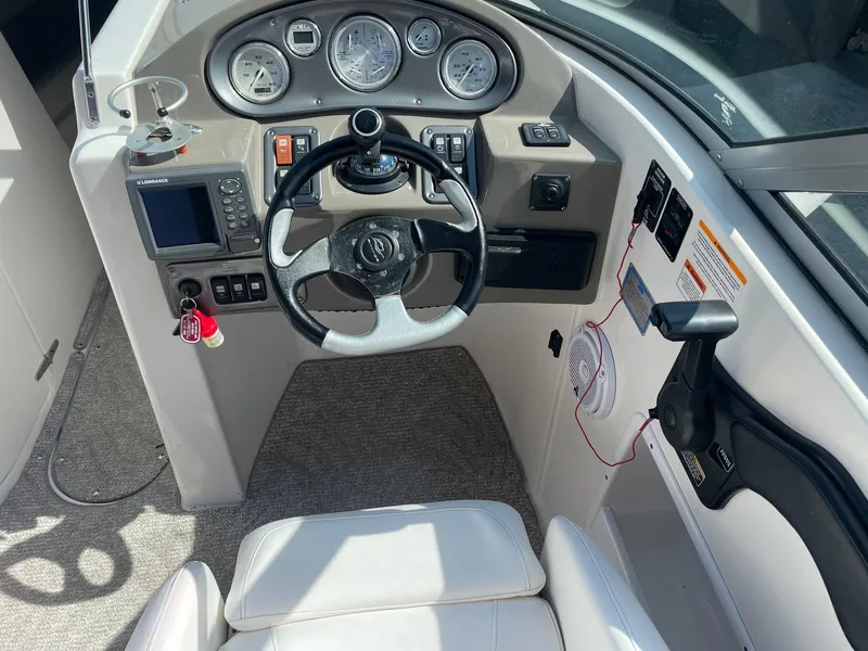 Slide: The Image of 2007 Rinker 282 Captiva Bowrider cockpit with steering wheel and instrument panel. - 4