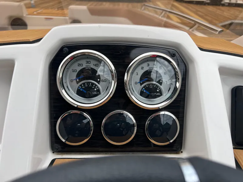 Slide: The Image of Dashboard of 2025 Starcraft SVX 211 OB boat with gauges and controls. - 8