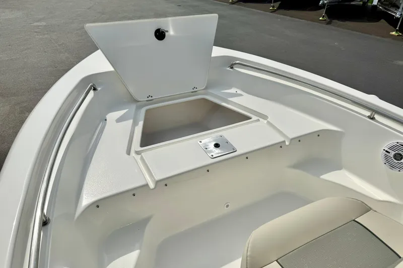 Slide: The Image of 2025 Key West 189 FS boat interior with open storage compartment and seating area. - 14