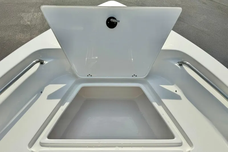 Slide: The Image of Open storage compartment on 2025 Key West 189 FS boat, featuring sleek design and sturdy handles. - 15