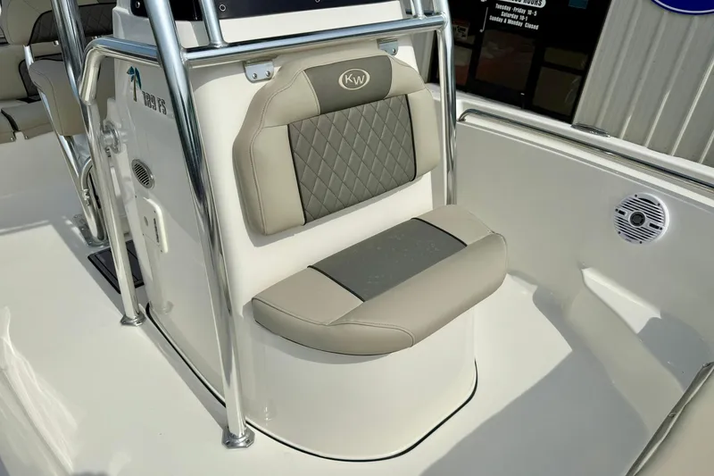 Slide: The Image of 2025 Key West 189 FS boat seat with gray and beige cushioned design. - 16
