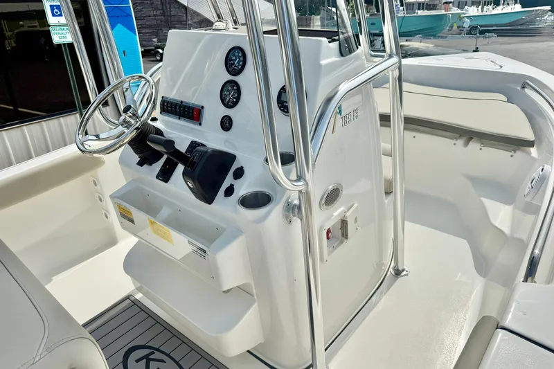 Slide: The Image of 2025 Key West 189 FS boat console with steering wheel and gauges. - 19