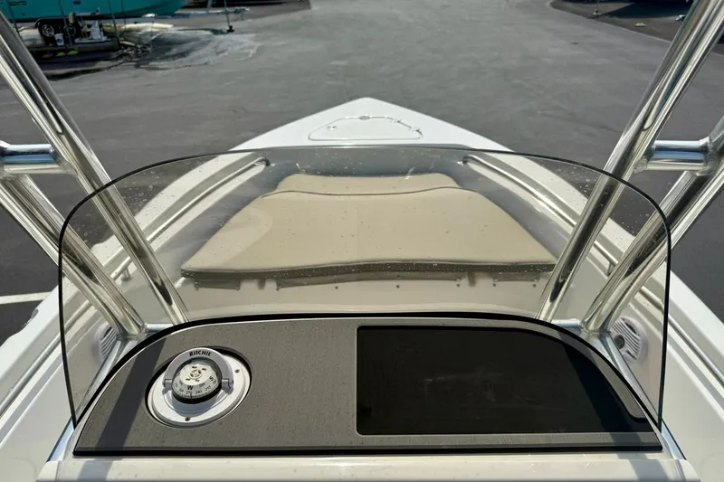 Slide: The Image of 2025 Key West 189 FS boat dashboard with windshield and seating area. - 21