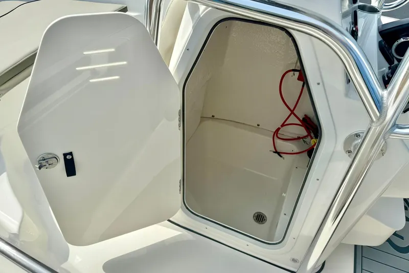 Slide: The Image of Open storage compartment on 2025 Key West 189 FS boat, featuring interior wiring. - 24