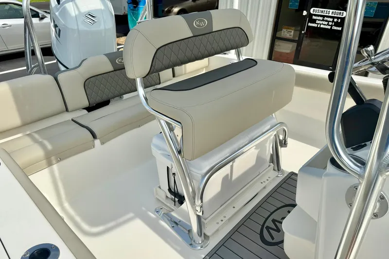 Slide: The Image of 2025 Key West 189 FS boat interior with cushioned seating and stainless steel frame. - 25