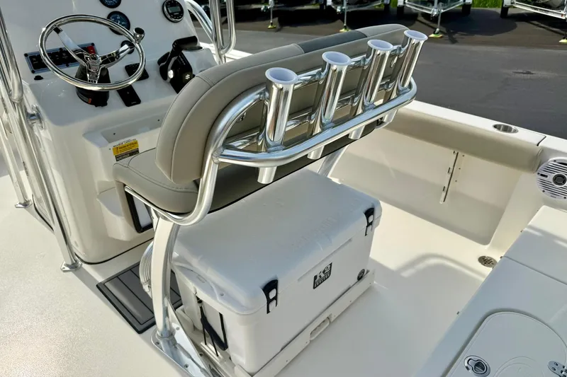 Slide: The Image of 2025 Key West 189 FS boat interior with helm, rod holders, and cooler. - 27