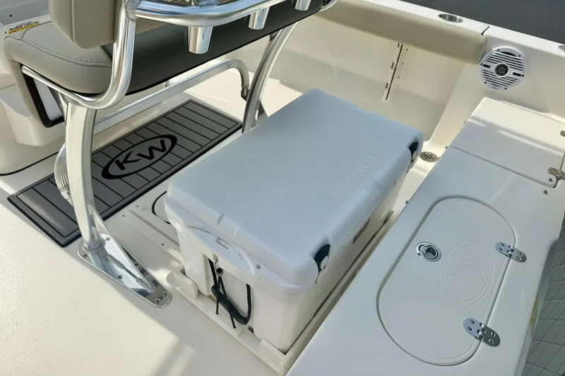 Slide: The Image of 2025 Key West 189 FS boat interior with cooler and seating area. - 28