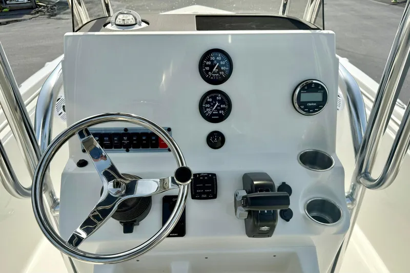 Slide: The Image of Control panel of 2025 Key West 189 FS boat with steering wheel and gauges. - 3