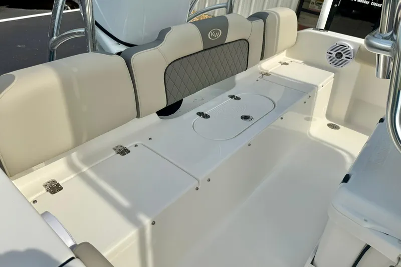 Slide: The Image of 2025 Key West 189 FS boat interior with cushioned seating and storage compartments. - 31