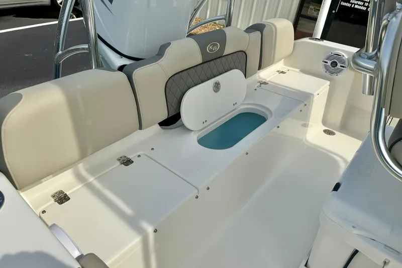 Slide: The Image of 2025 Key West 189 FS boat interior with cushioned seating and storage compartments. - 32