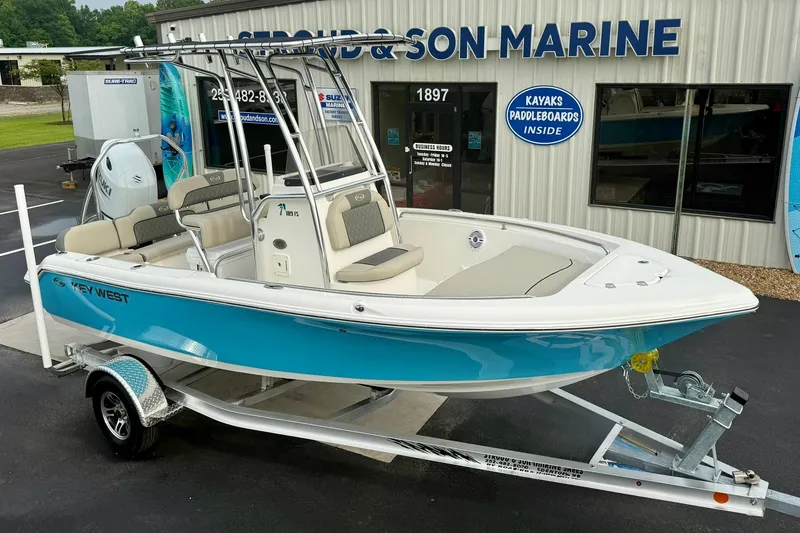 Slide: The Image of 2025 Key West 189 FS boat on trailer at marine dealership. - 9