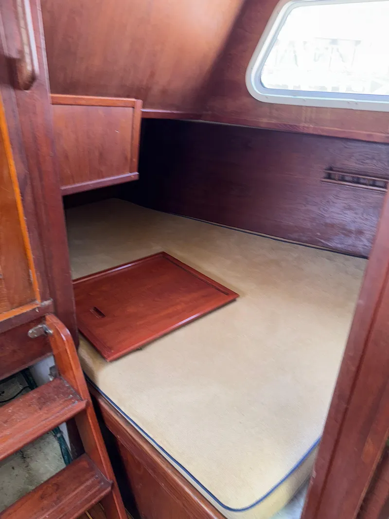 Slide: The Image of Cozy cabin interior of 1980 Cooper Marine Mapleleaf 48 sailboat with wooden finish. - 16