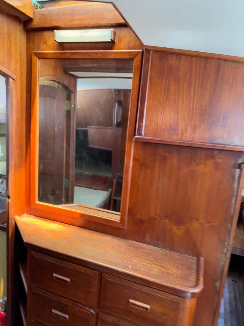 Slide: The Image of Wooden interior of 1980 Cooper Marine Mapleleaf 48 yacht with mirror and drawers. - 19