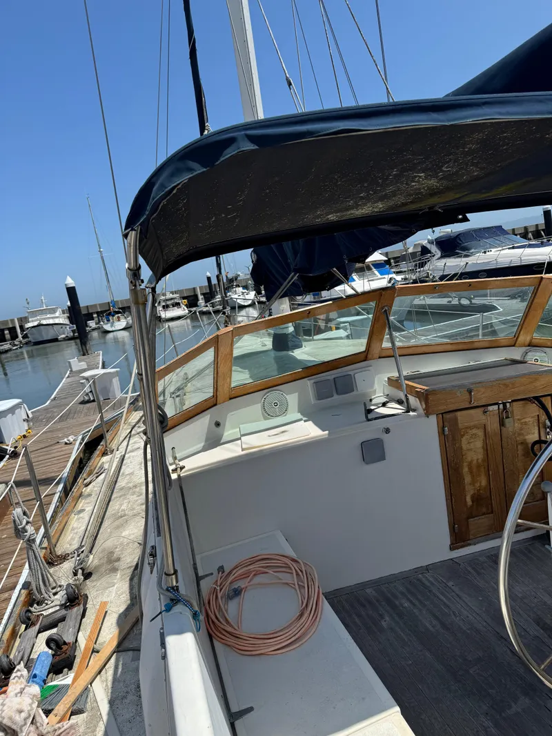 Slide: The Image of 1980 Cooper Marine Mapleleaf 48 sailboat docked at marina under clear blue sky. - 5