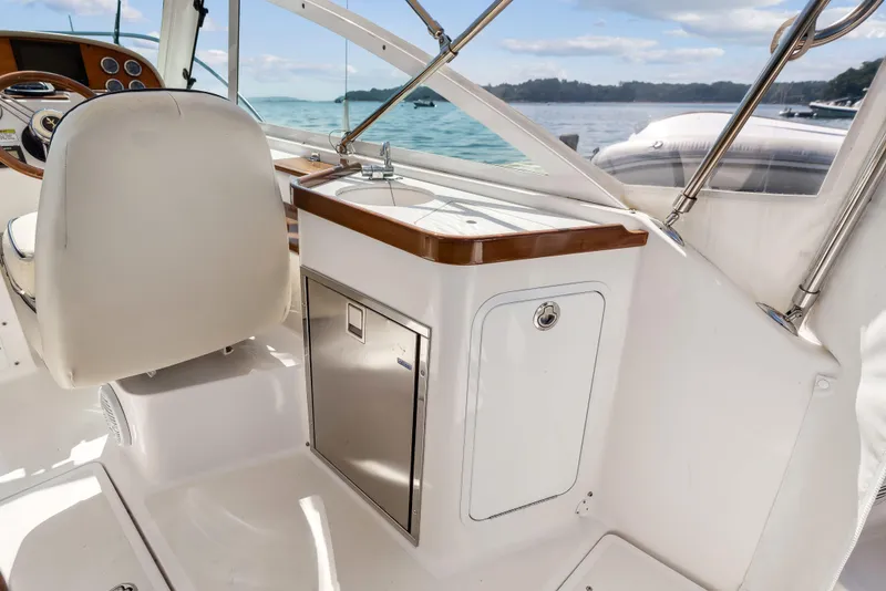 Slide: The Image of 2015 Hunt Yachts 25 Harrier interior with sleek cabinetry and ocean view. - 49