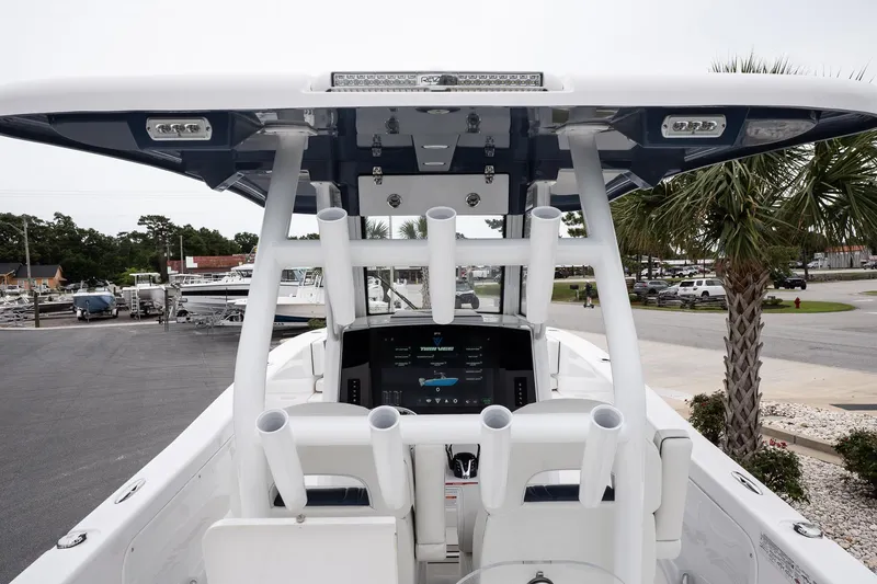 Slide: The Image of 2025 Twin Vee 260 GFX2 CC boat console with modern controls and seating. - 27