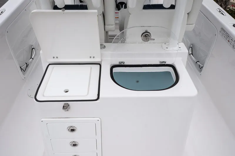 Slide: The Image of 2025 Twin Vee 260 GFX2 CC boat interior with storage and sink. - 29