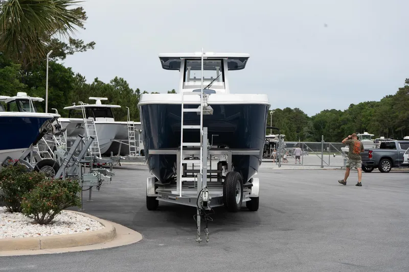 Slide: The Image of 2025 Twin Vee 260 GFX2 CC boat on trailer in parking lot. - 5