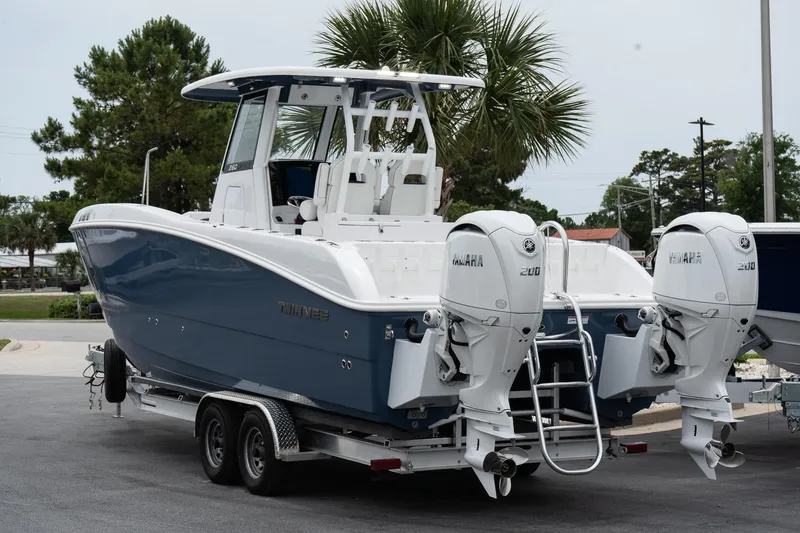Slide: The Image of 2025 Twin Vee 260 GFX2 CC boat with dual engines on a trailer. - 7