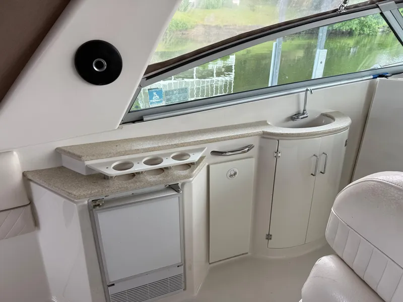 Slide: The Image of 2001 Monterey 322 Cruiser interior with sink, counter, and storage cabinets. - 14