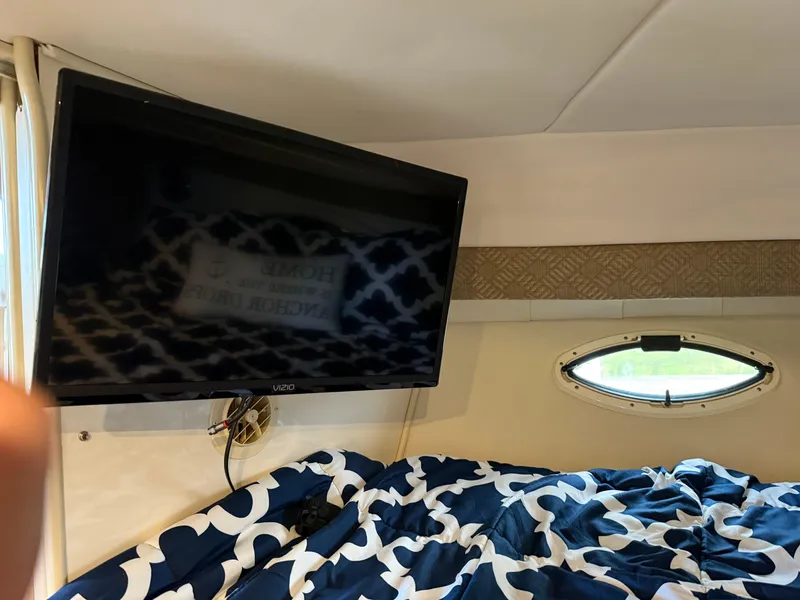 Slide: The Image of Interior of 2001 Monterey 322 Cruiser with TV and patterned bedding. - 18