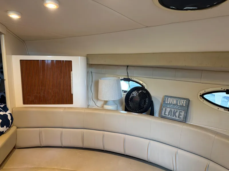 Slide: The Image of Interior of 2001 Monterey 322 Cruiser with beige seating, lamp, and decor. - 19