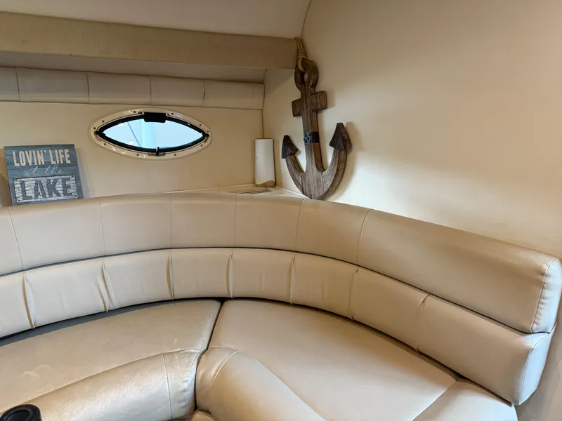 Slide: The Image of Interior of 2001 Monterey 322 Cruiser with beige seating and nautical decor. - 20