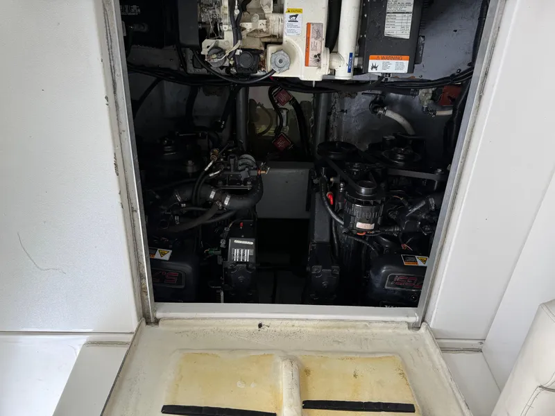 Slide: The Image of 2001 Monterey 322 Cruiser engine compartment with visible dual engines and wiring. - 27