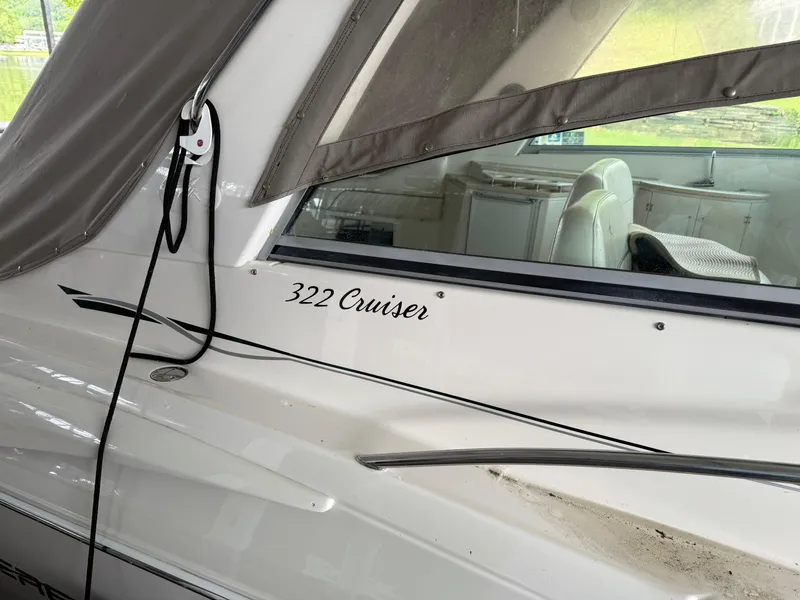 Slide: The Image of 2001 Monterey 322 Cruiser boat with canopy and interior view. - 7