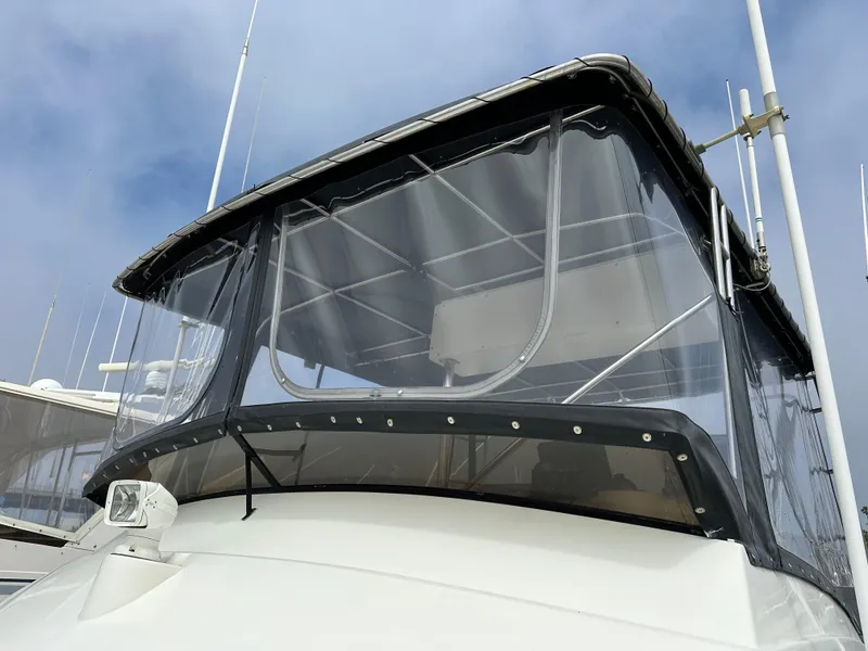 Slide: The Image of 1978 Bertram 46 Convertible boat with clear enclosure and radar equipment. - 12