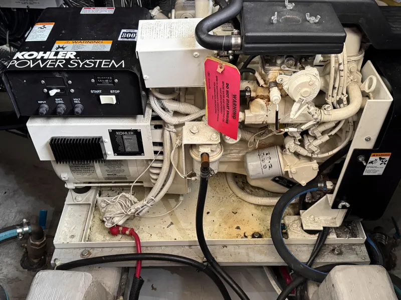 Slide: The Image of Engine room of 1999 Carver 406 Aft Cabin Motor Yacht with Kohler power system. - 43