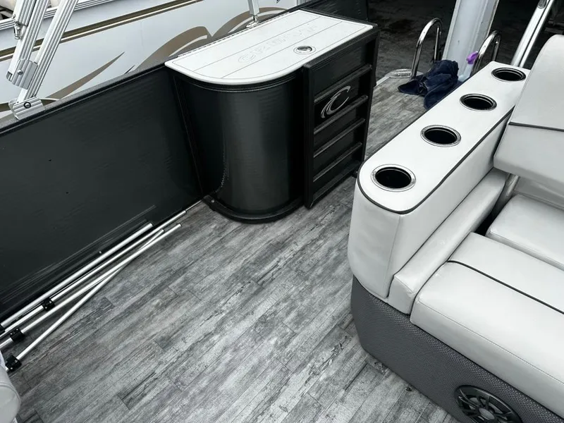 Slide: The Image of Interior of 2021 Crest Classic LX 240 SLS boat with seating and storage. - 8