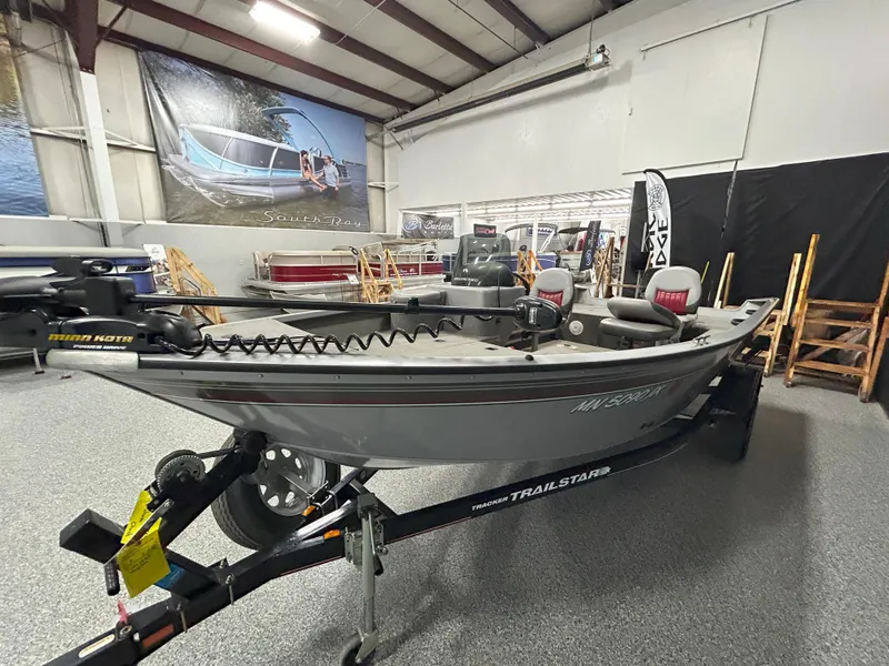 Slide: The Image of 2005 Tracker Targa 17 SC boat on a Trailstar trailer in a showroom. - 3