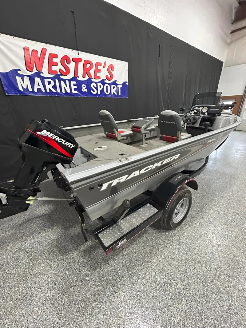 Slide: The Image of 2005 Tracker Targa 17 SC boat displayed at Westre's Marine & Sport showroom. - 5