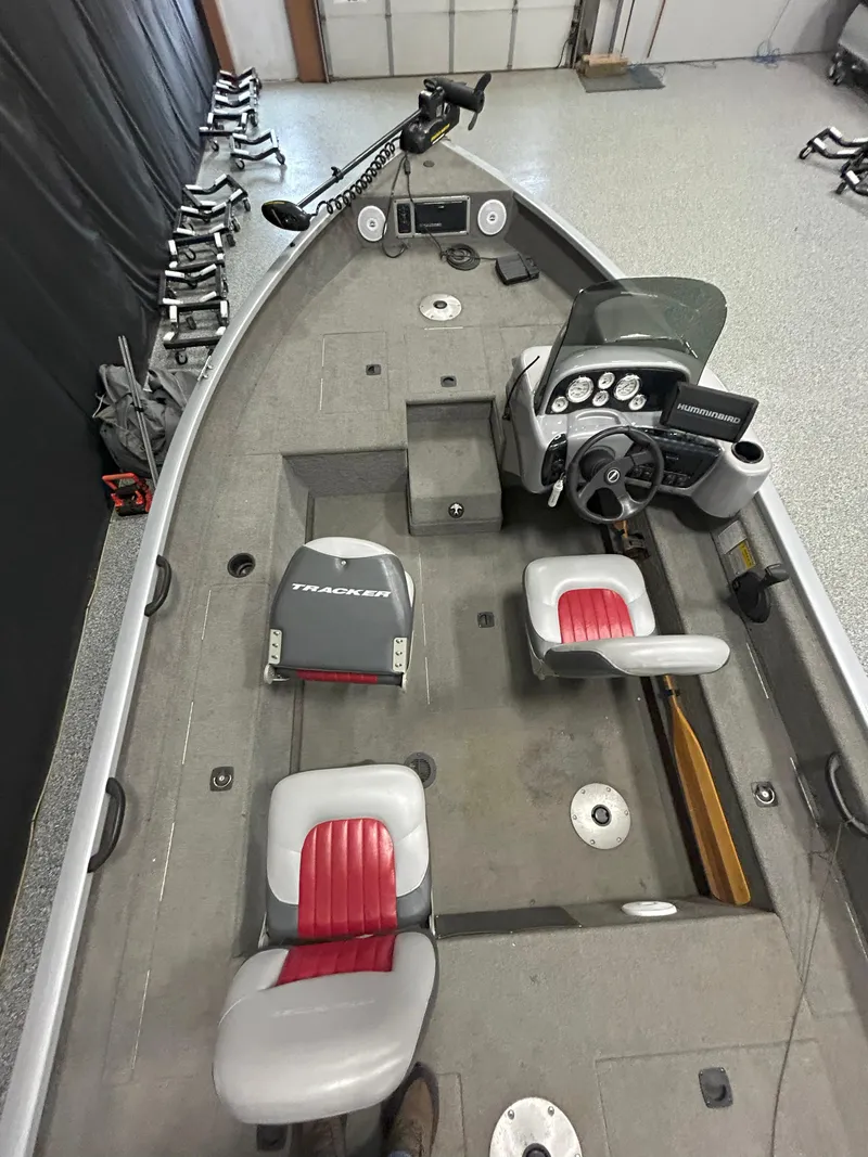 Slide: The Image of 2005 Tracker Targa 17 SC boat interior with steering console and seating. - 8