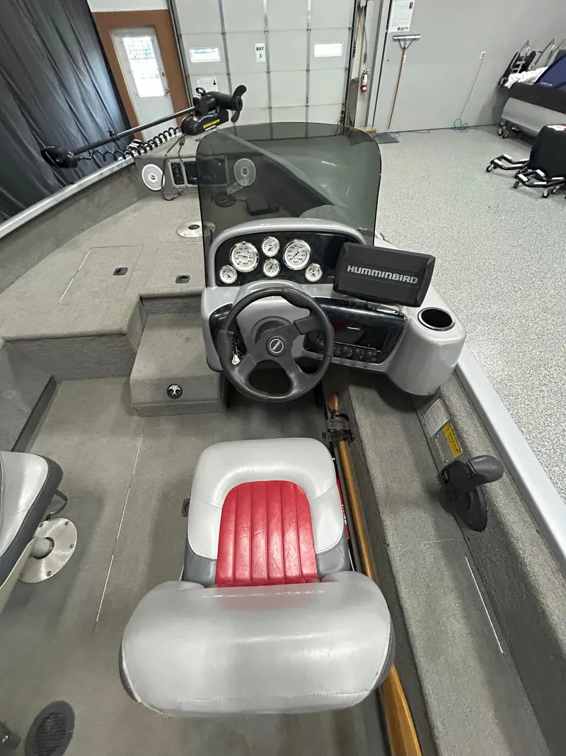 Slide: The Image of 2005 Tracker Targa 17 SC boat interior with steering wheel and Humminbird electronics. - 9