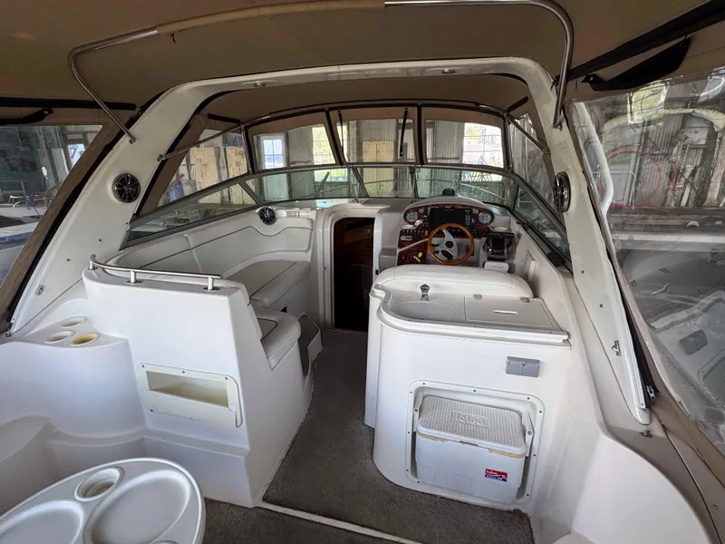 Slide: The Image of 2004 Rinker Fiesta Vee 290 boat interior with helm, seating, and dashboard. - 14