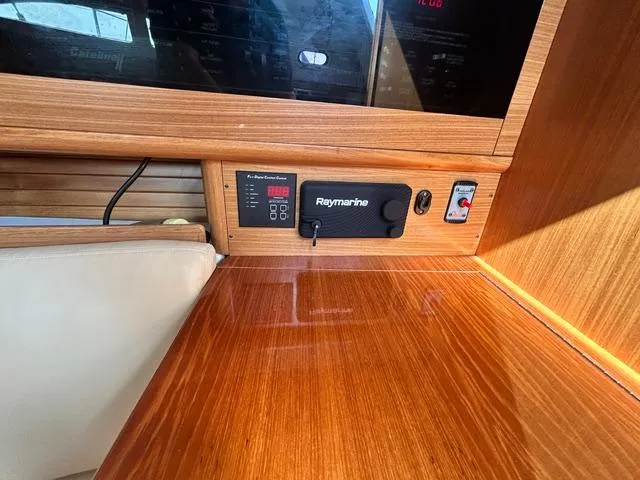 Slide: The Image of Control panel of a 2015 Catalina 315 sailboat with Raymarine equipment. - 13