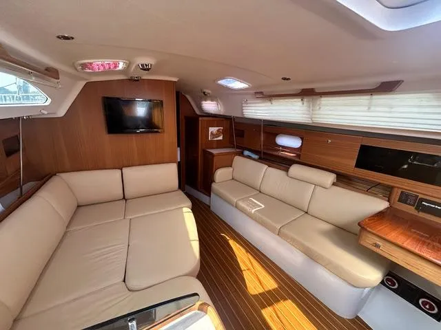 Slide: The Image of Luxurious interior of a 2015 Catalina 315 yacht with beige seating and wood accents. - 9